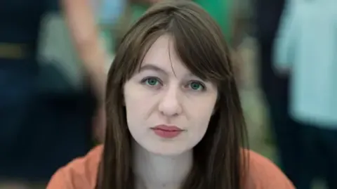 Irish author Sally Rooney states she is unable to travel to the UK over potential arrest