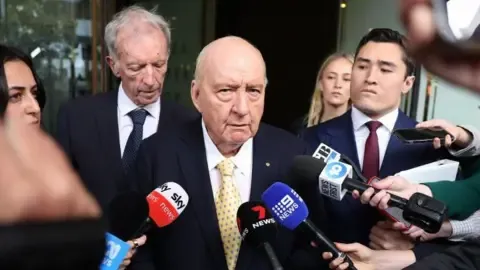 Sexual Assault Charges Against Prominent Down Under Broadcaster Lessened